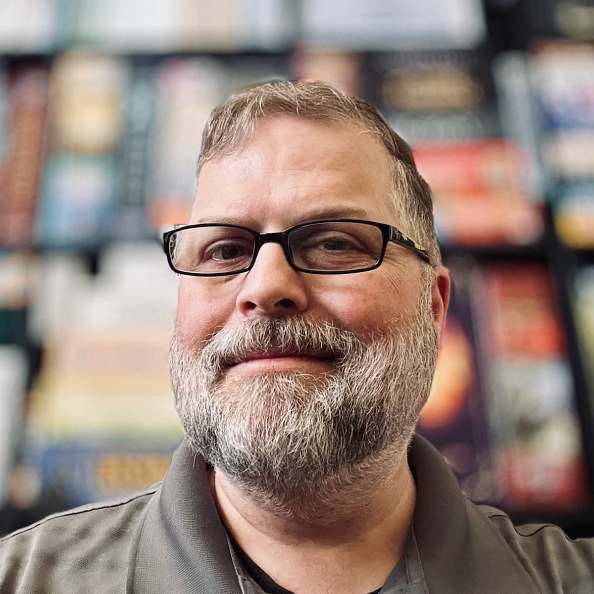 A headshot of Jason Katzwinkel with a blurry background.